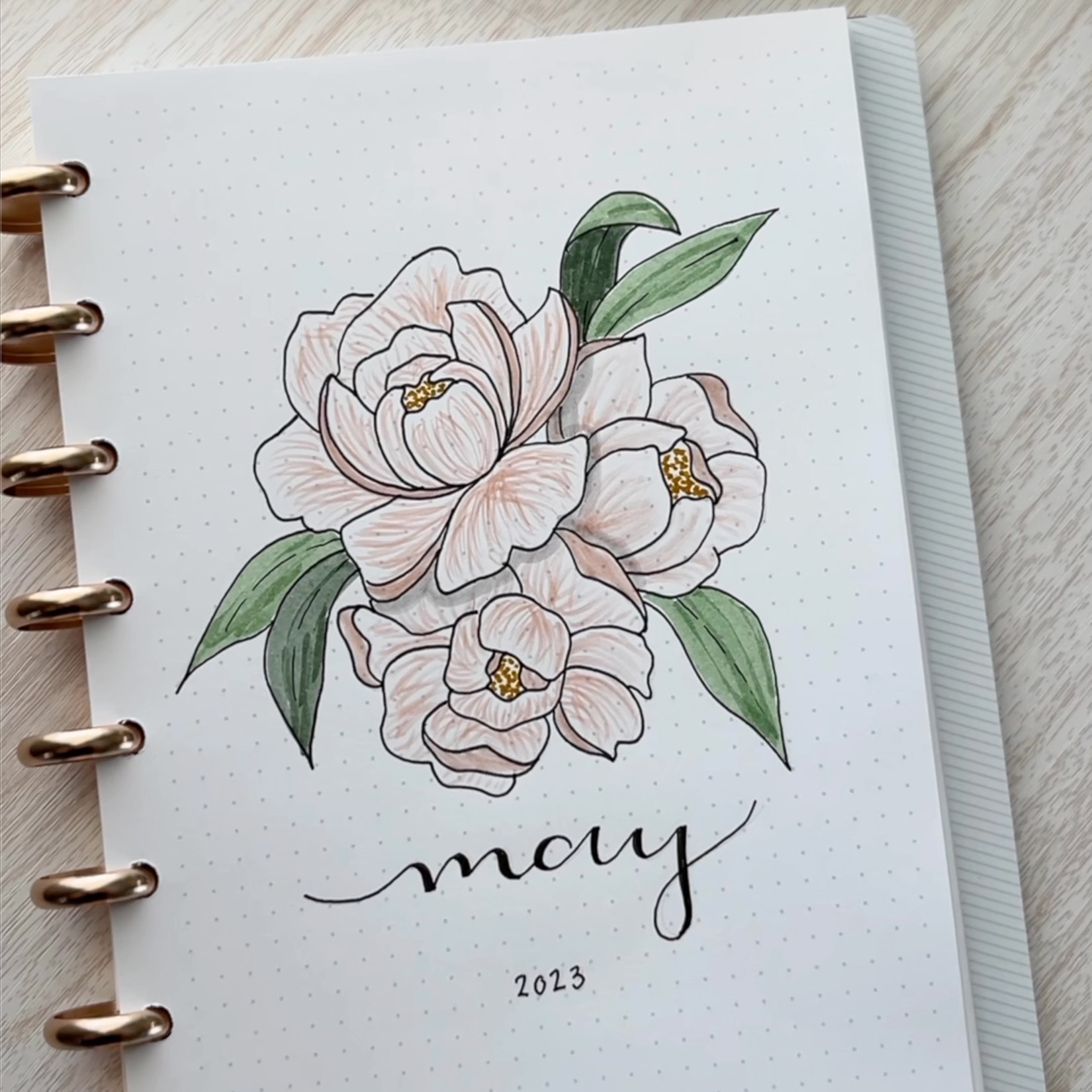 Discbound Bullet Journal with Flower Art & 'May' written below Discbound Bullet Journal with Flower Art & 'May' written below