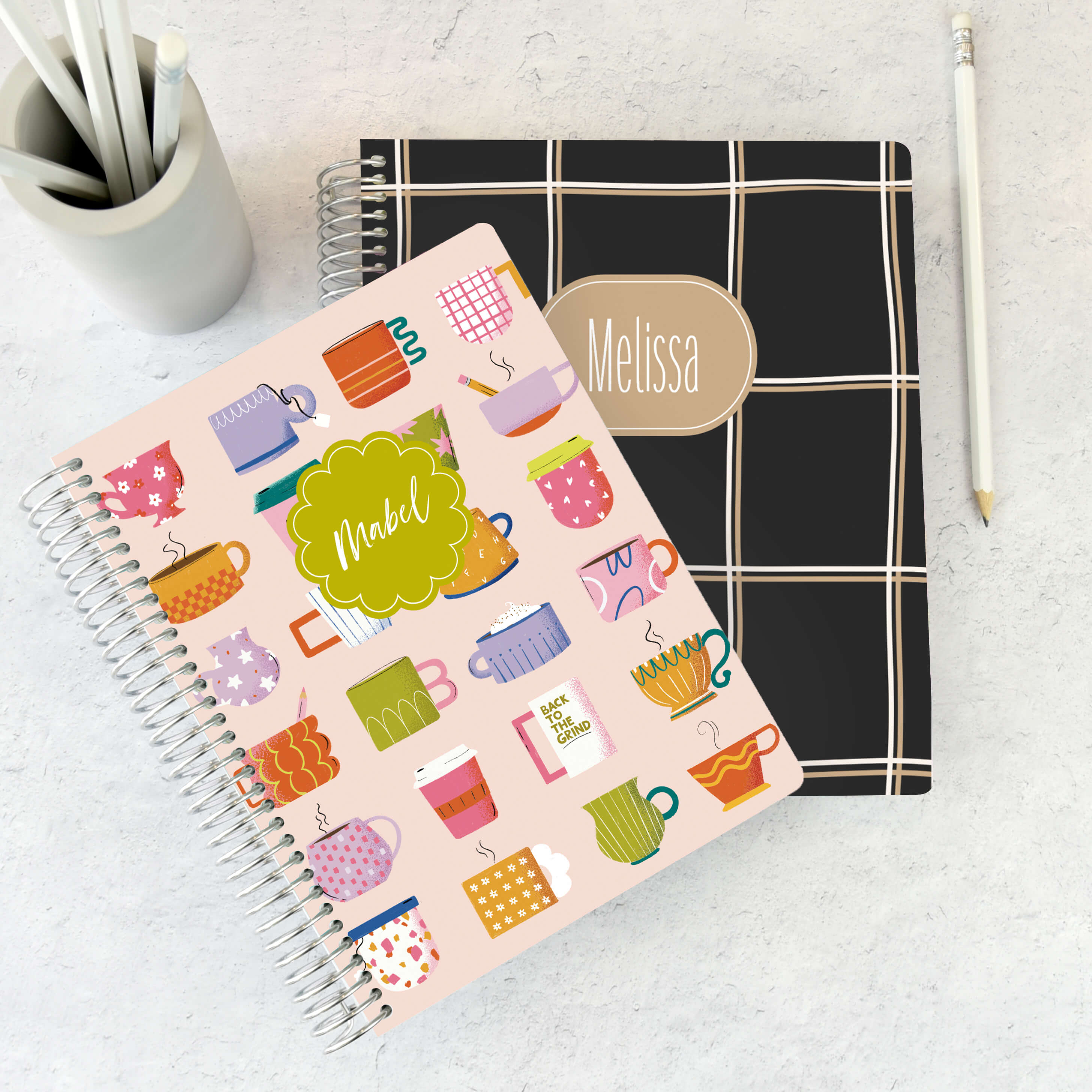 A personalized A5 Planner sitting on top of a personalized 7x9 Planner A personalized A5 Planner sitting on top of a personalized 7x9 Planner