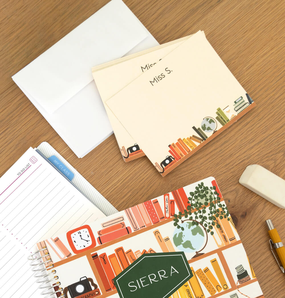 Woman holding personalized stationery that says "Collette" Woman holding personalized stationery that says "Collette"