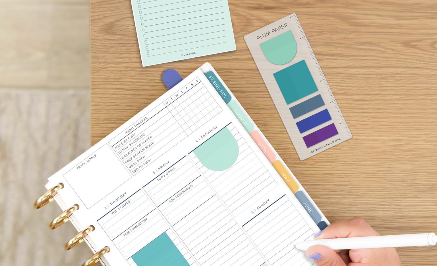 Woman putting a notepad into a pencil pouch Woman putting a notepad into a pencil pouch