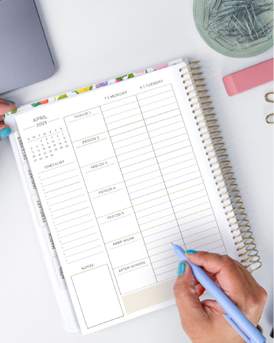 Middle and High School Planner on desk with person holding pen. Middle and High School Planner on desk with person holding pen.
