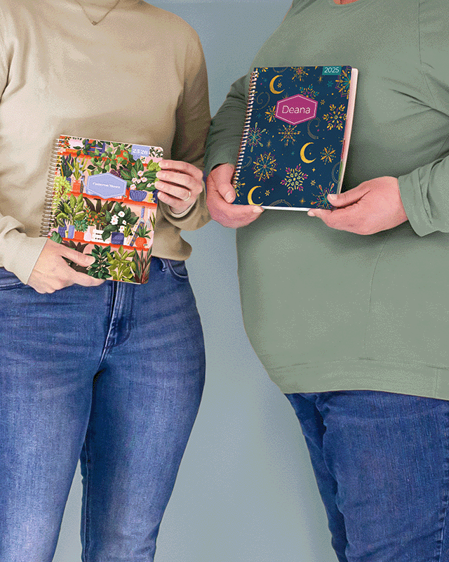 Two people holding personalized planners with colorful designs. Two people holding personalized planners with colorful designs.