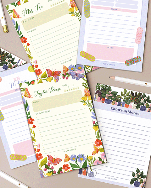 Several personalized notepads on table with pencils Several personalized notepads on table with pencils