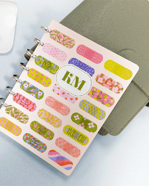 Disc Bound Planner with bandage art on top of sage green folio. Disc Bound Planner with bandage art on top of sage green folio.