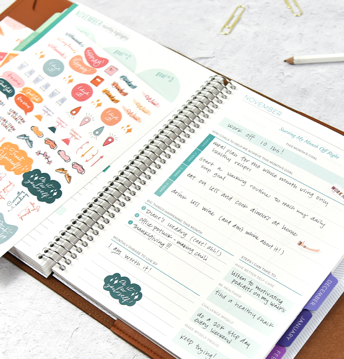 Filled out goal planner with pen and stickers Filled out goal planner with pen and stickers