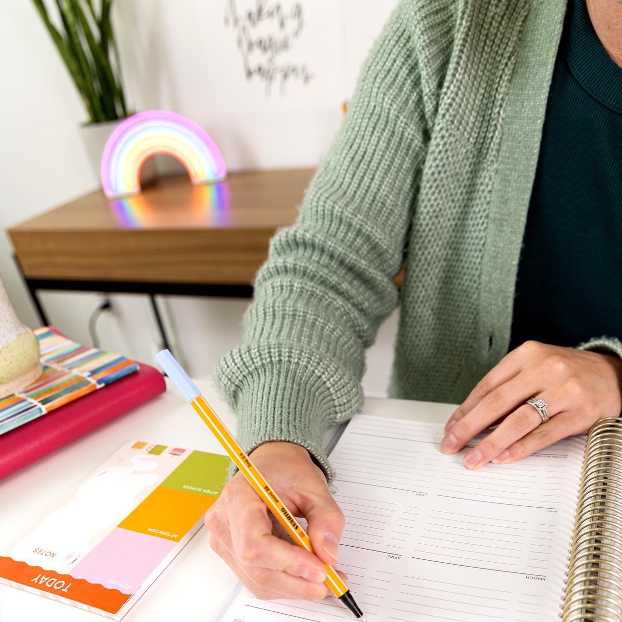 teacher writing in planner teacher writing in planner