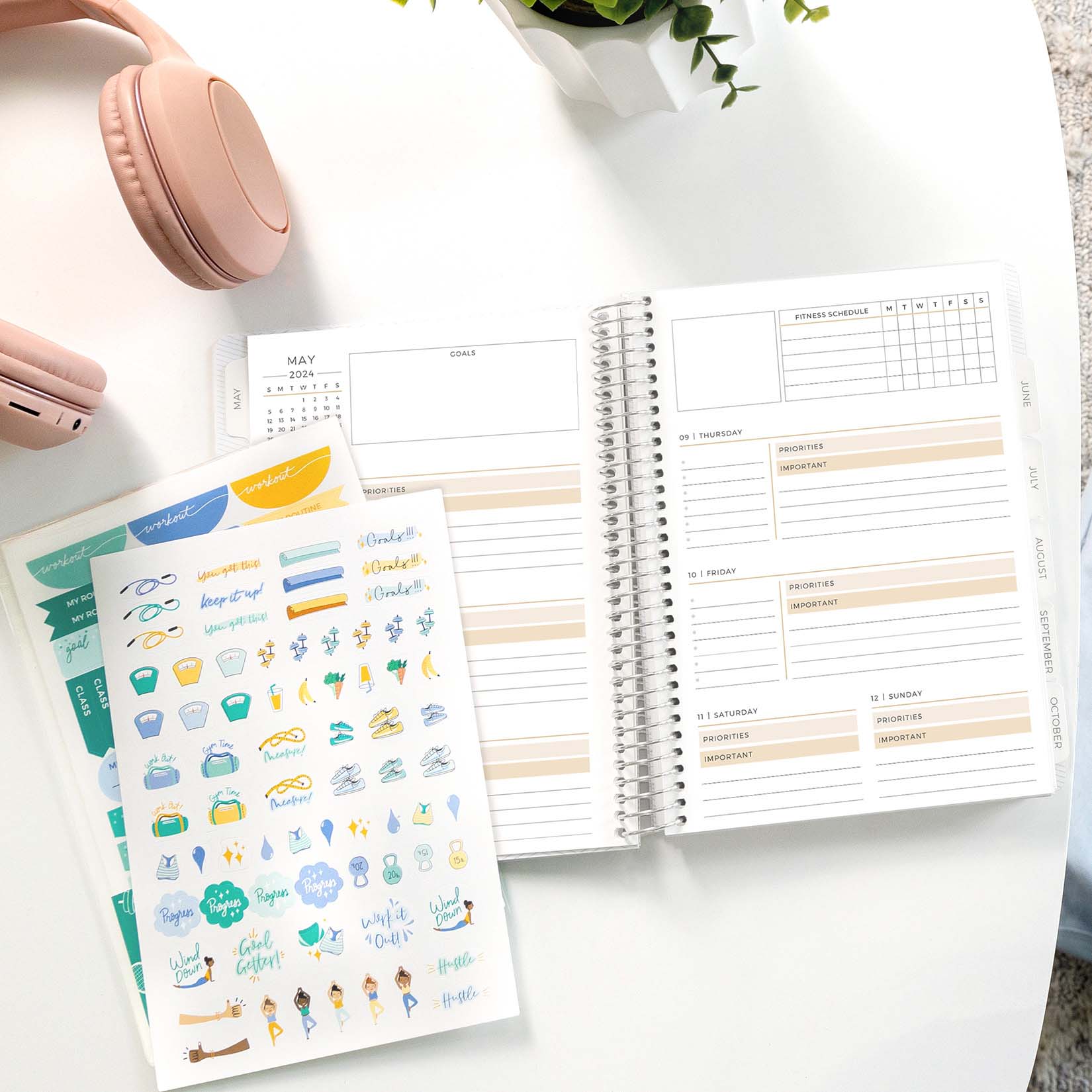 fitness add-on stickers and horizontal priorities planner on a table