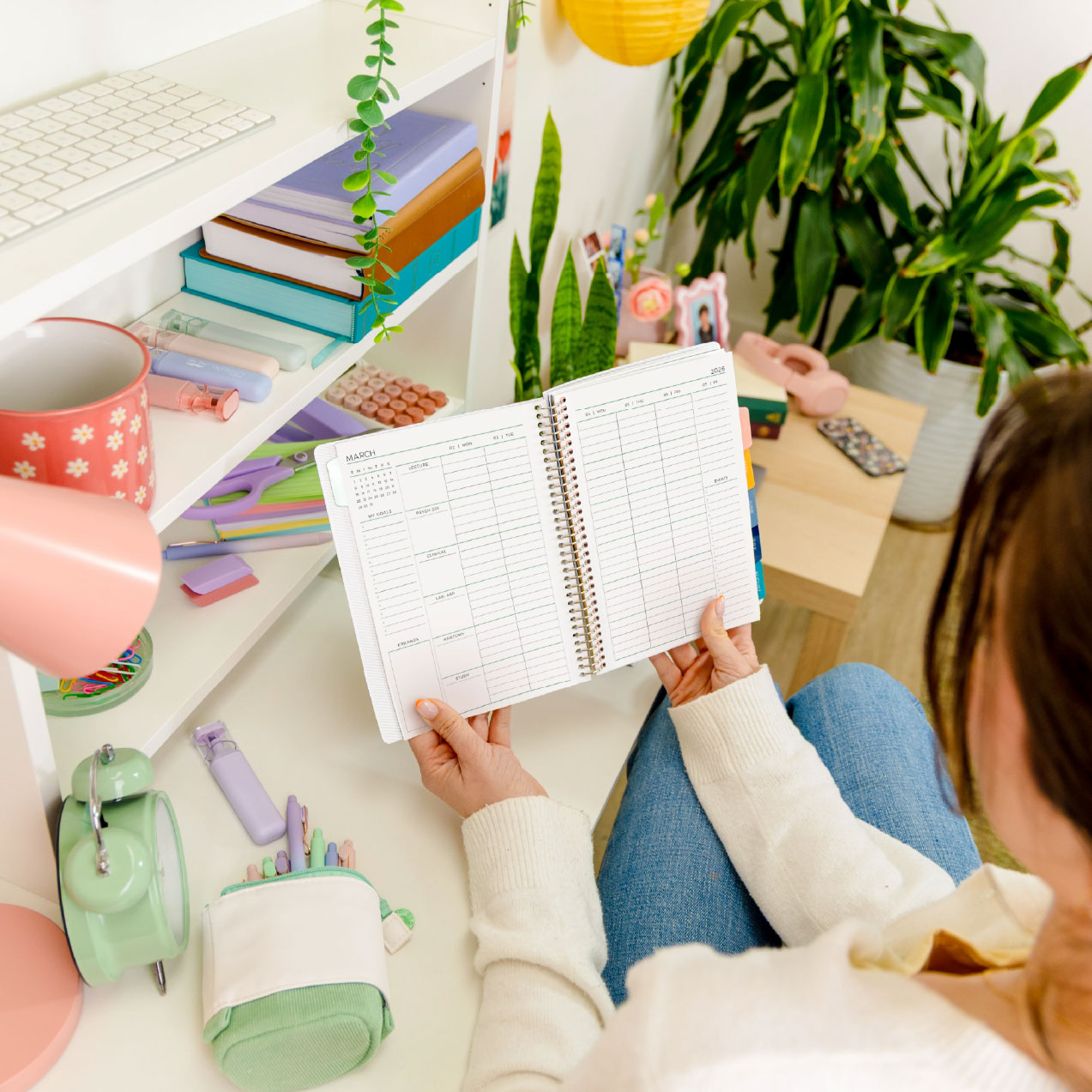woman using Plum paper's planner notebook