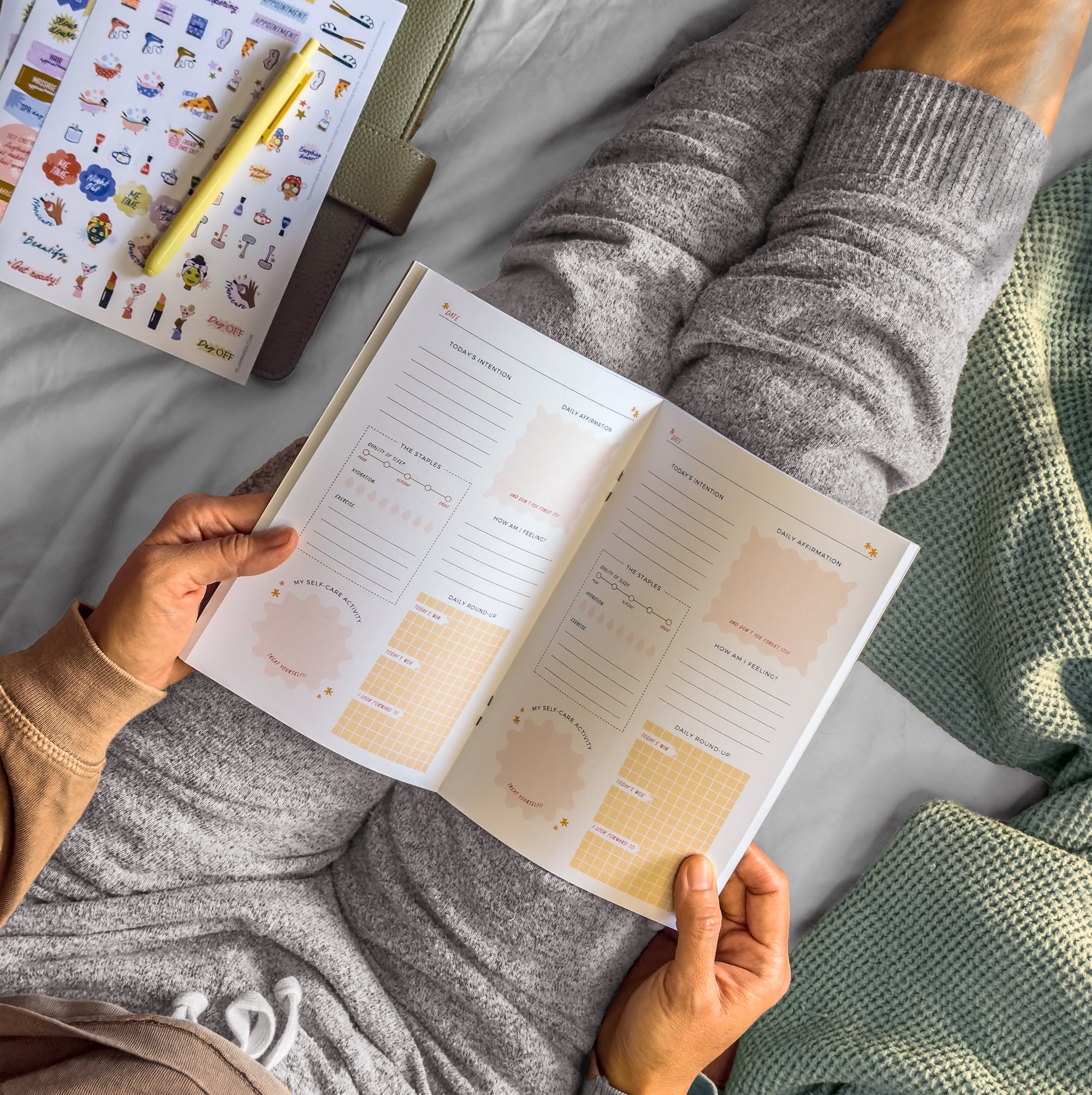 Plum paper's self care journal being used in bed Plum paper's self care journal being used in bed