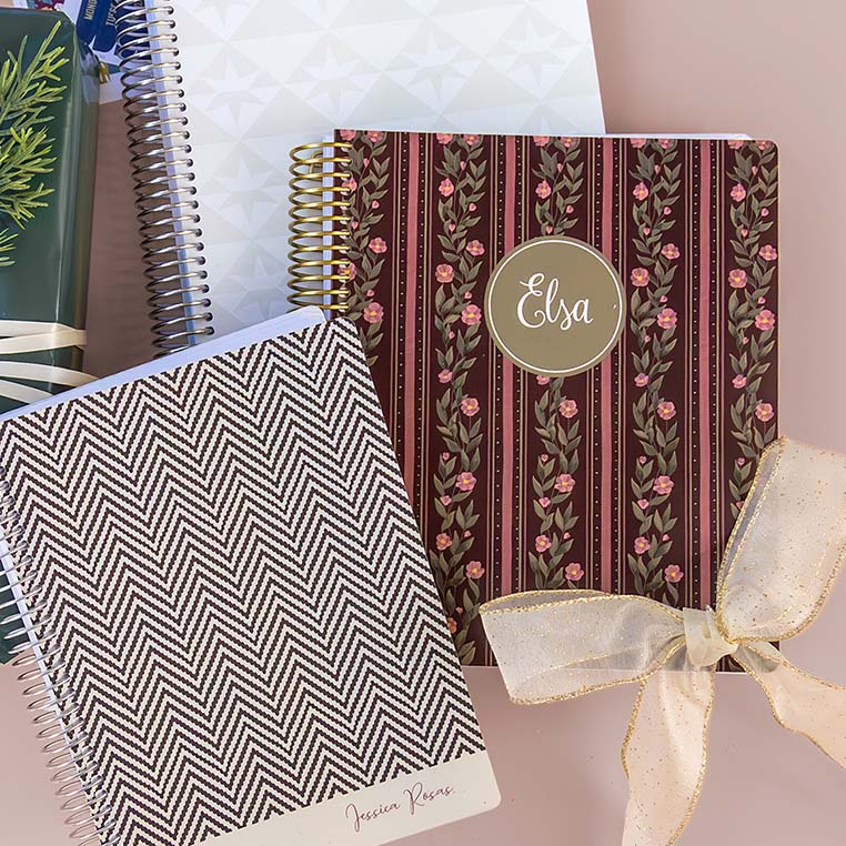 Stack of Plum Paper handmade planners and customizable notebooks, including a floral pattern cover personalized with “Elsa” and tied with a ribbon — perfect holiday gift ideas for 2026 custom planners and personalized stationery lovers. Stack of Plum Paper handmade planners and customizable notebooks, including a floral pattern cover personalized with “Elsa” and tied with a ribbon — perfect holiday gift ideas for 2026 custom planners and personalized stationery lovers.
