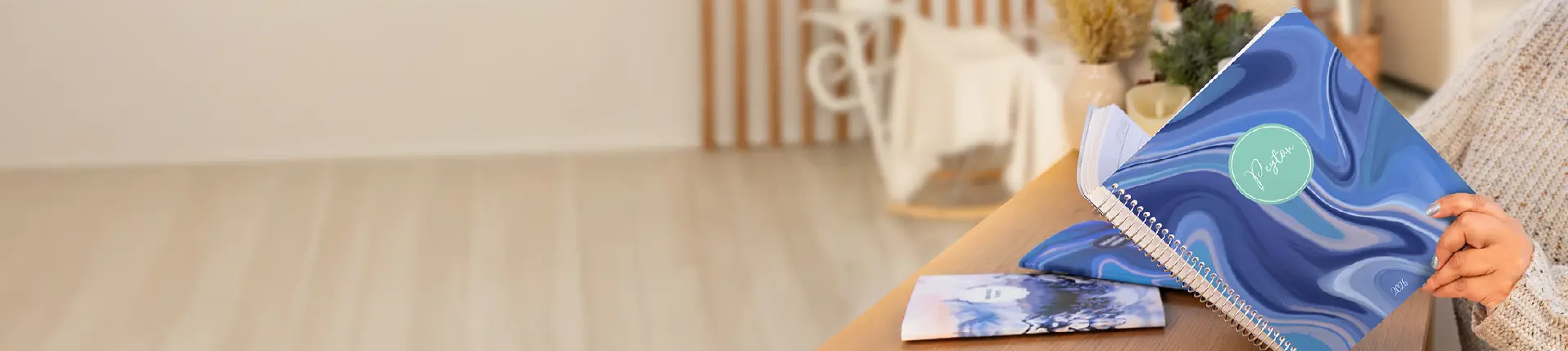 Woman holding a planner with a Blue cover Woman holding a planner with a Blue cover