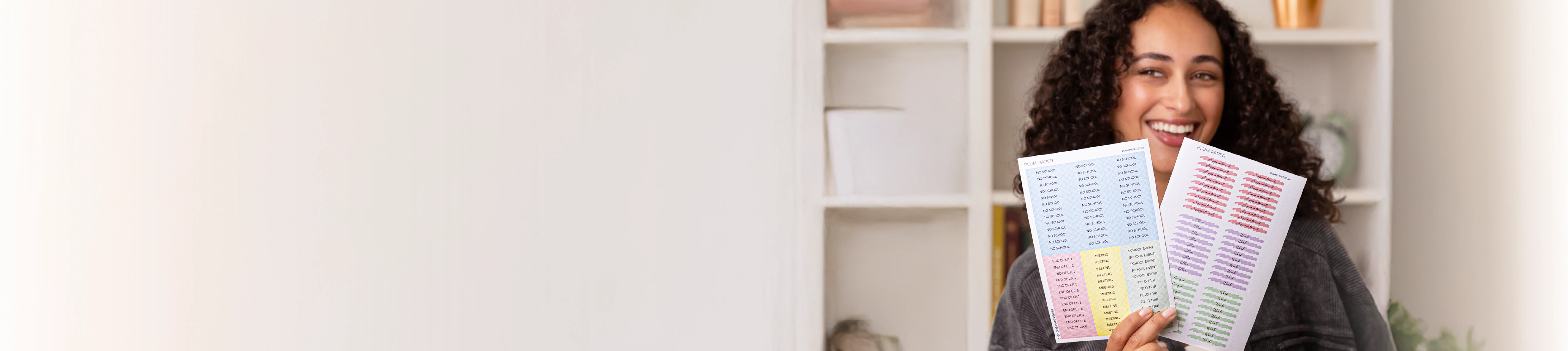 woman holding custom stickers