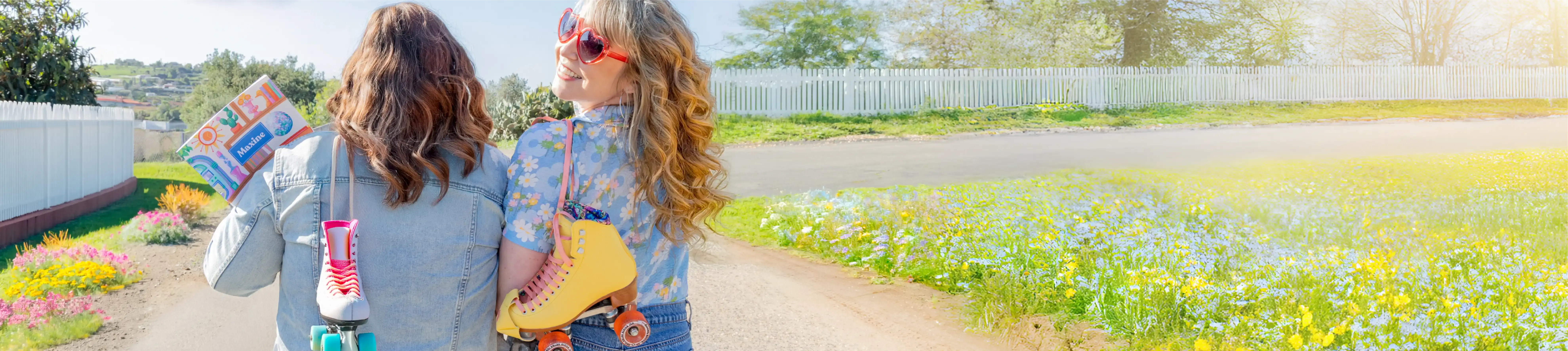 Women walking on a bright sunny day carrying a Plum Paper planner