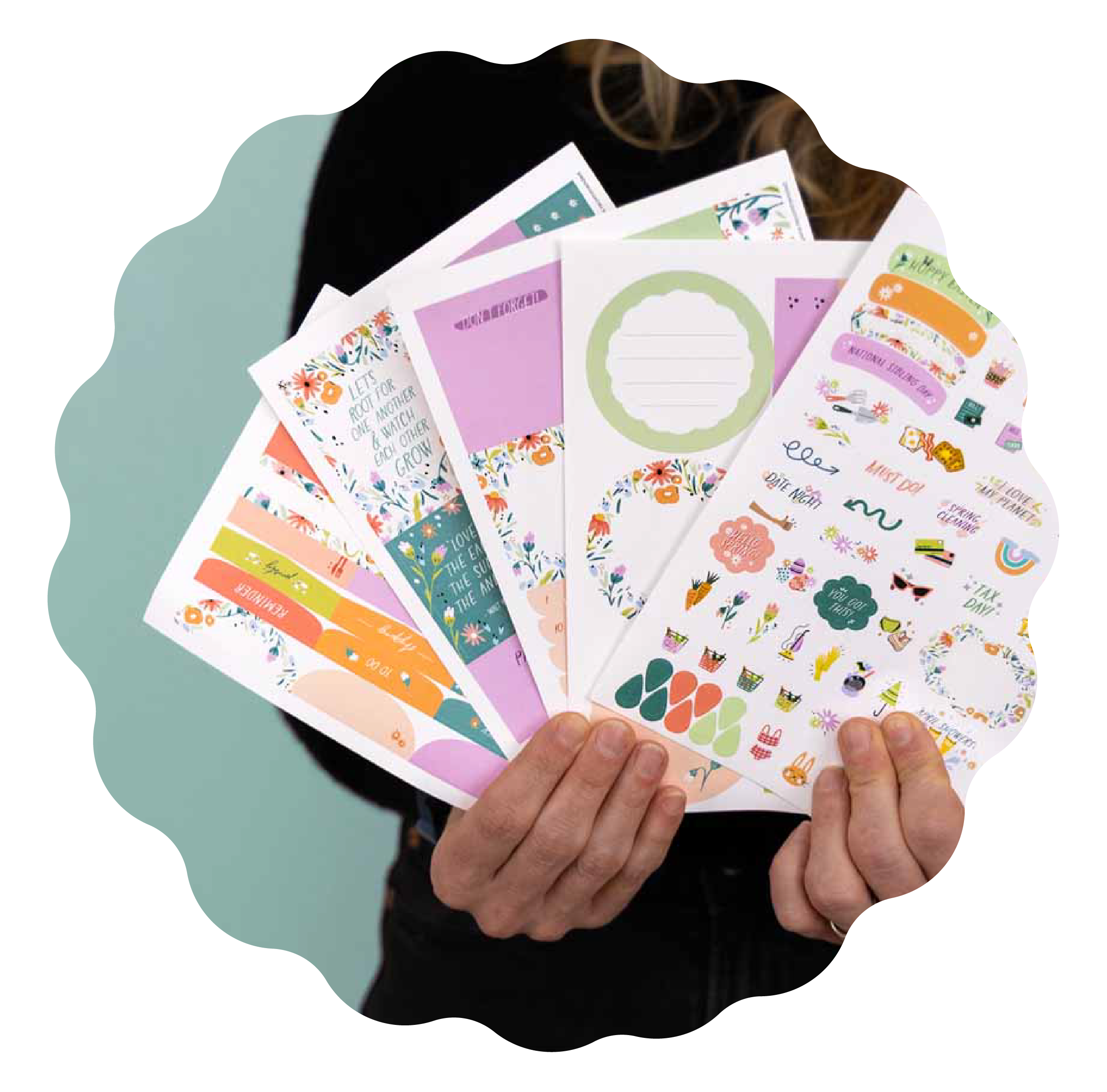 person holding multiple planner sticker packs person holding multiple planner sticker packs