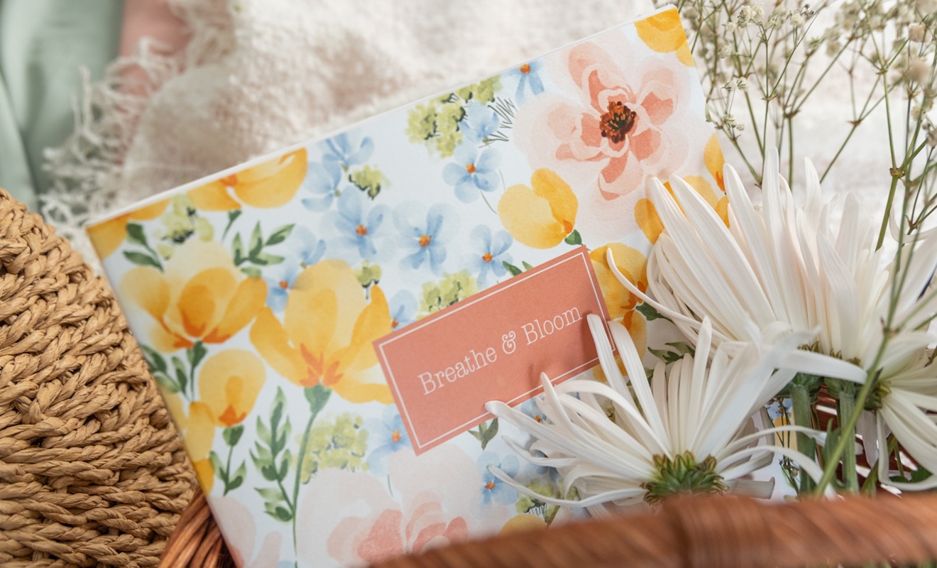 Two vertical layout planners side by side in soft florals and bright blooms designs Two vertical layout planners side by side in soft florals and bright blooms designs