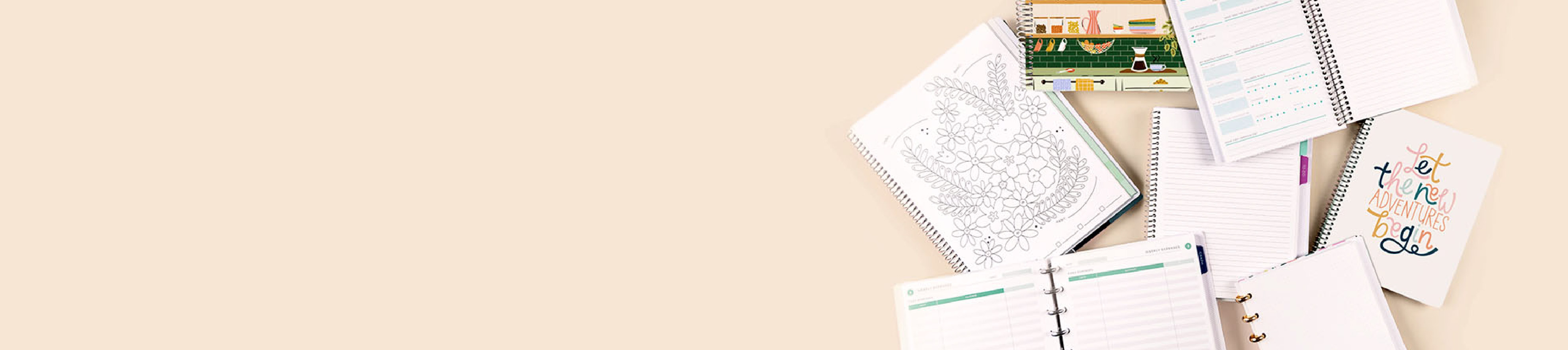 Notebooks laying flat showing different layouts with a beige background Notebooks laying flat showing different layouts with a beige background