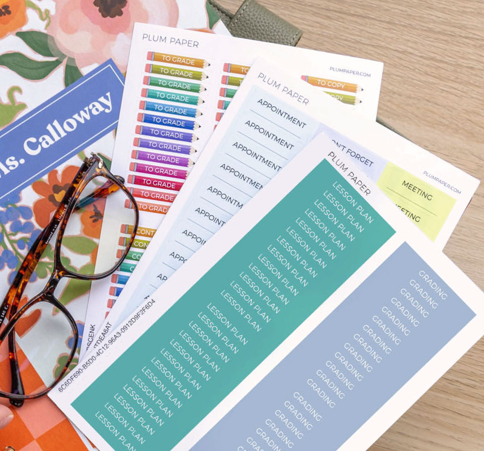 Flat-lay of large customizable sticker sheets styled for classroom and teacher planning Flat-lay of large customizable sticker sheets styled for classroom and teacher planning