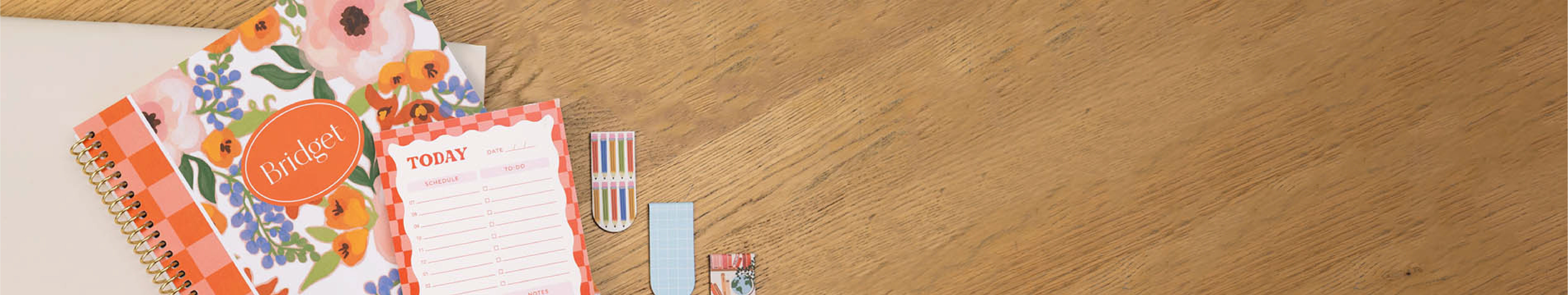Full-width promotional banner featuring the free Plum Paper notepad gift with purchase of $50 or more, styled with a flat-lay of the notepad alongside an open planner on a clean desk surface Full-width promotional banner featuring the free Plum Paper notepad gift with purchase of $50 or more, styled with a flat-lay of the notepad alongside an open planner on a clean desk surface