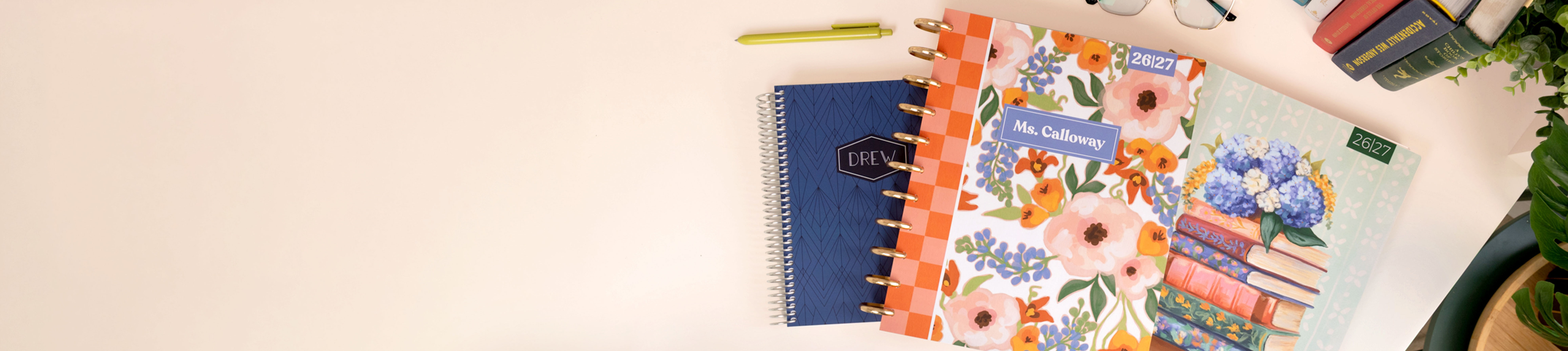 Plum Paper Planners on a beige desk Plum Paper Planners on a beige desk