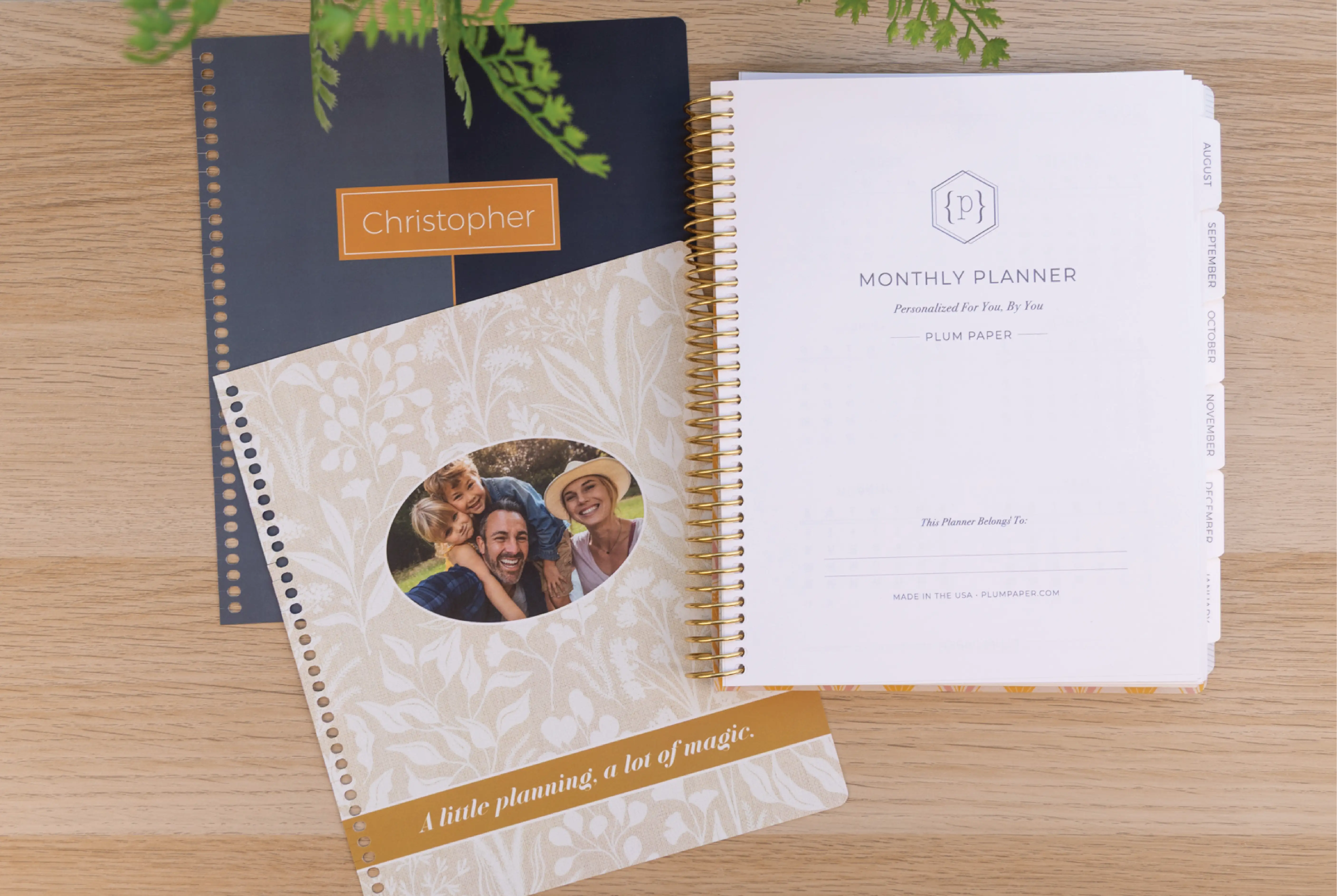 A Plum Paper Planner with 2 interchangeable covers on a desk