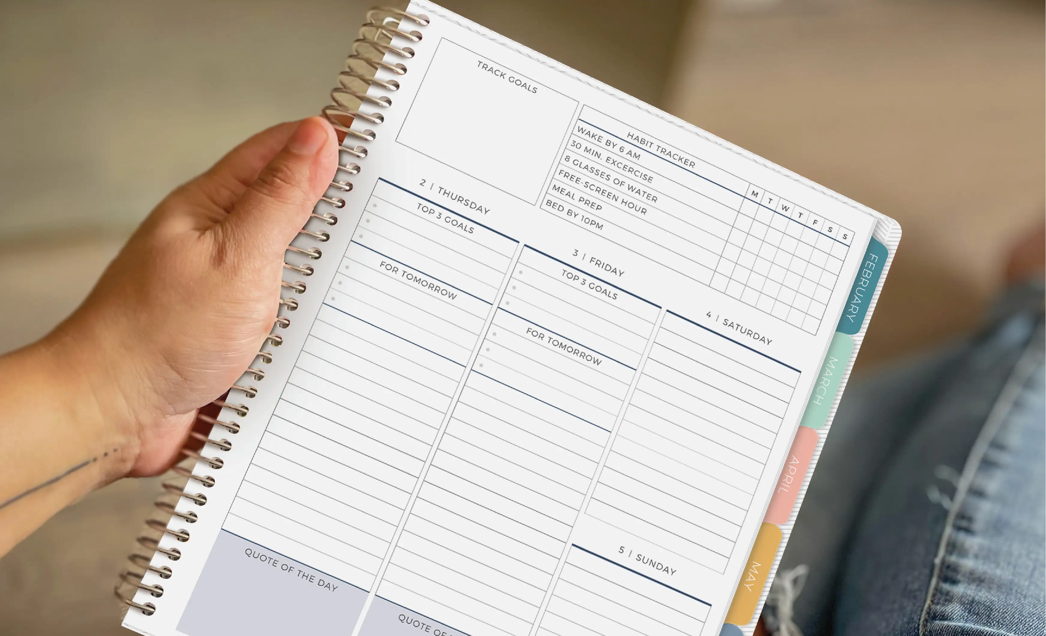 Hand holding Vertical Priorities Planner with custom headers Hand holding Vertical Priorities Planner with custom headers
