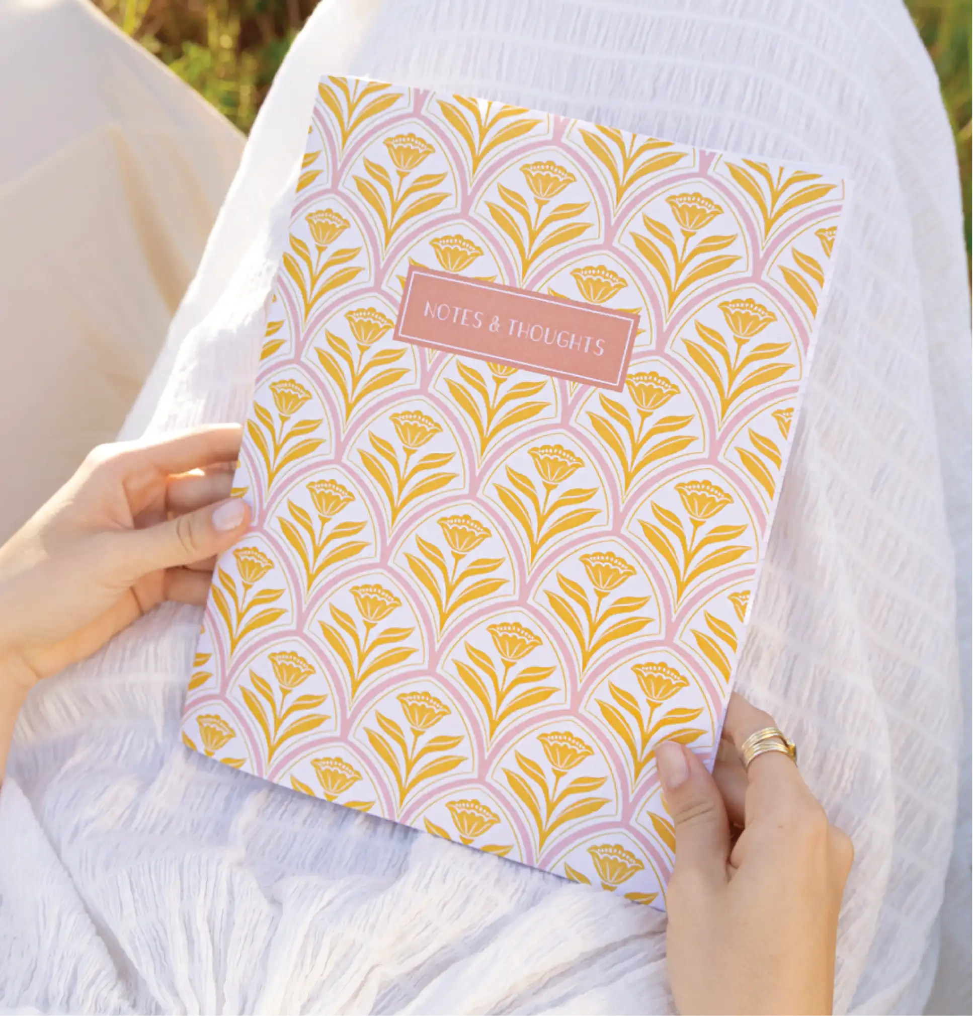 a woman holding a personalized journal a woman holding a personalized journal