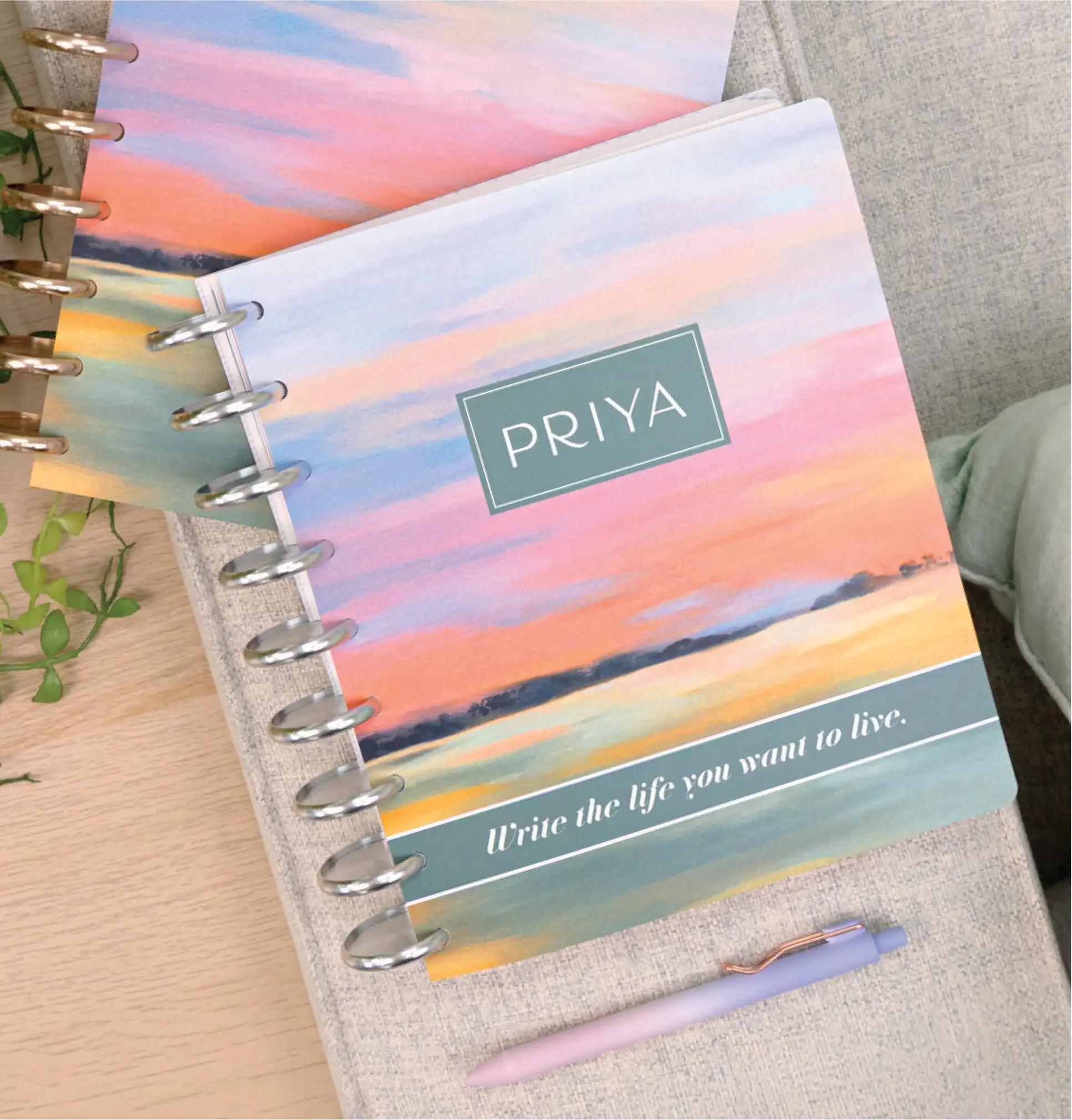 Planner with personalized cover that says "Priya"