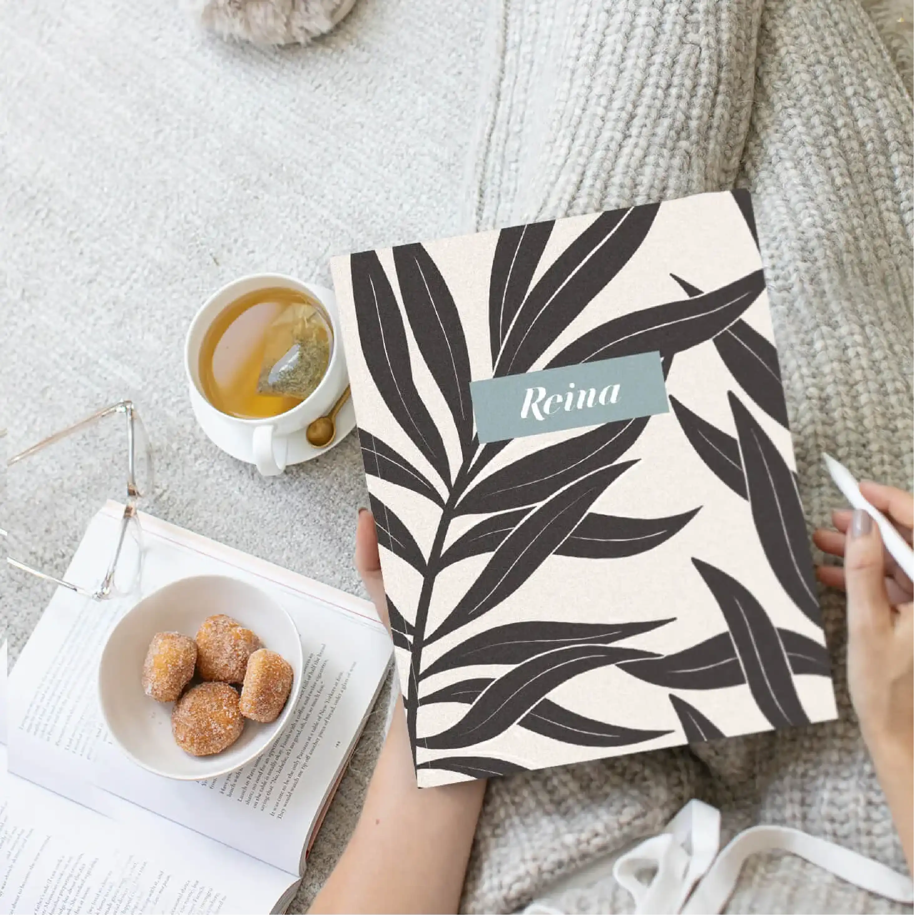 Woman holding medium saddle stitched planner with personalized cover Woman holding medium saddle stitched planner with personalized cover