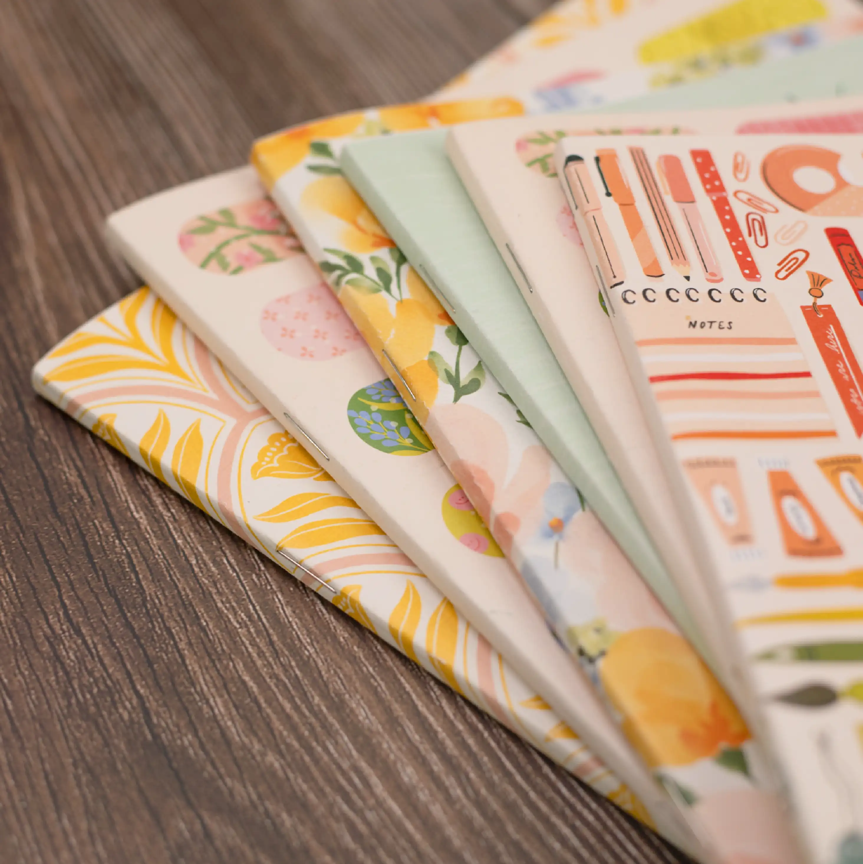 Saddle Stitch Planners Stacked with Binding showing Saddle Stitch Planners Stacked with Binding showing